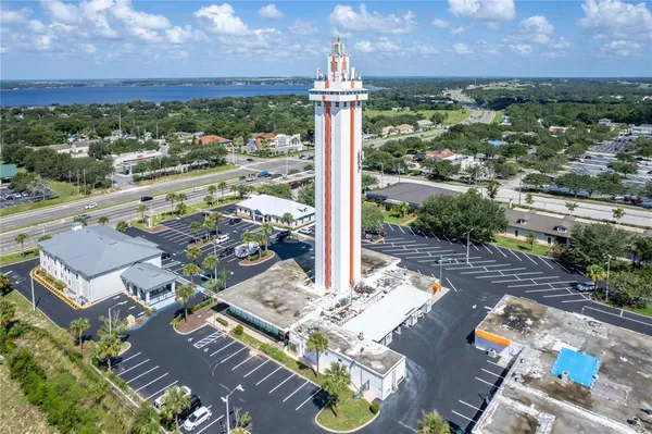 an aerial view of a residential apartment building with a yard