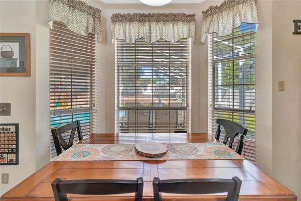 a dining room with furniture and window