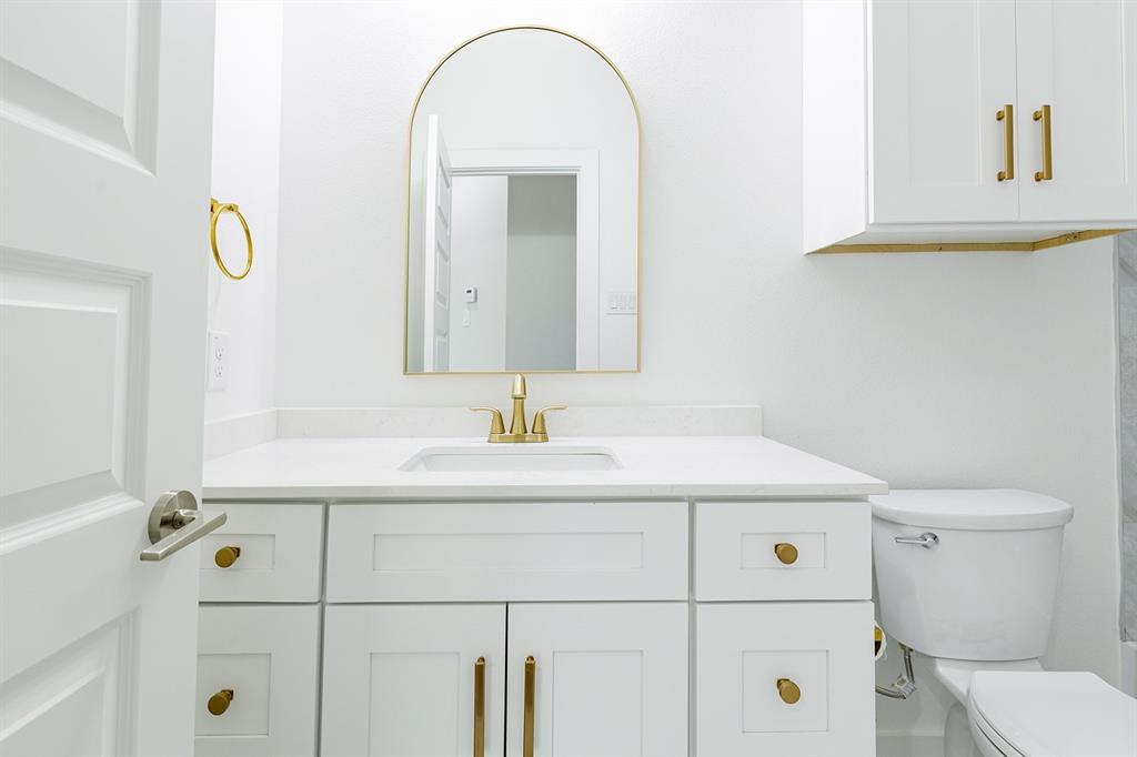 2809 Gooch Street Dallas, TX 75241 - Photo 12 of 19 a bathroom with a sink and a toilet