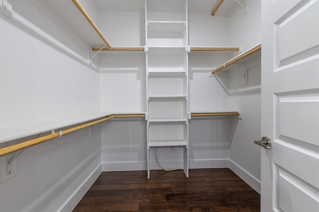 2809 Gooch Street Dallas, TX 75241 - Photo 16 of 19 a view of walk in closet with empty racks