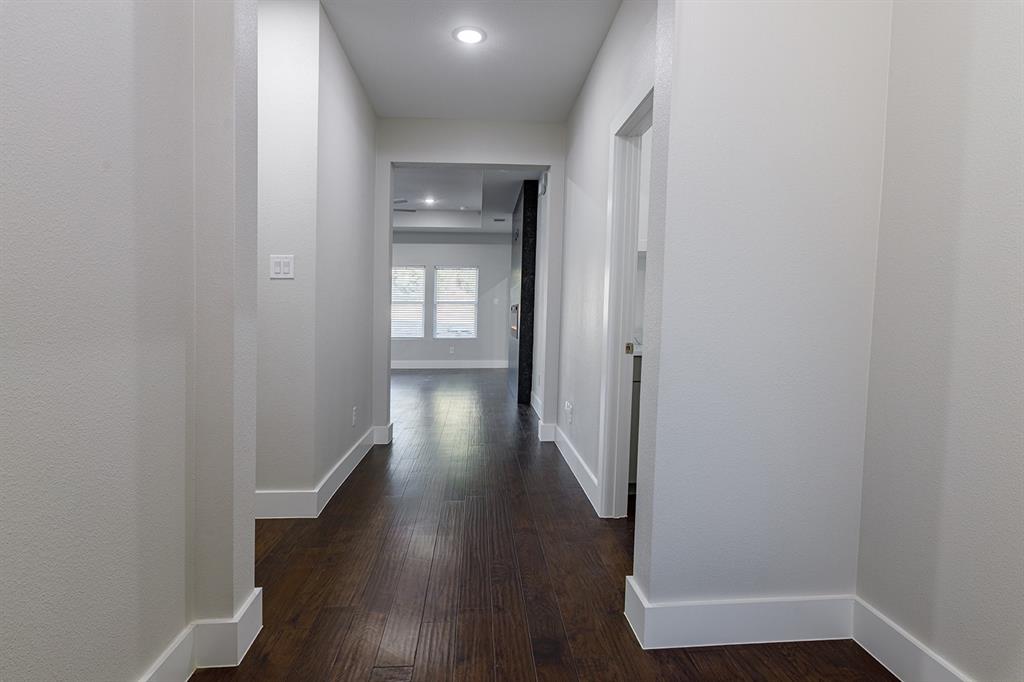 2809 Gooch Street Dallas, TX 75241 - Photo 3 of 19 a view of a hallway with wooden floor
