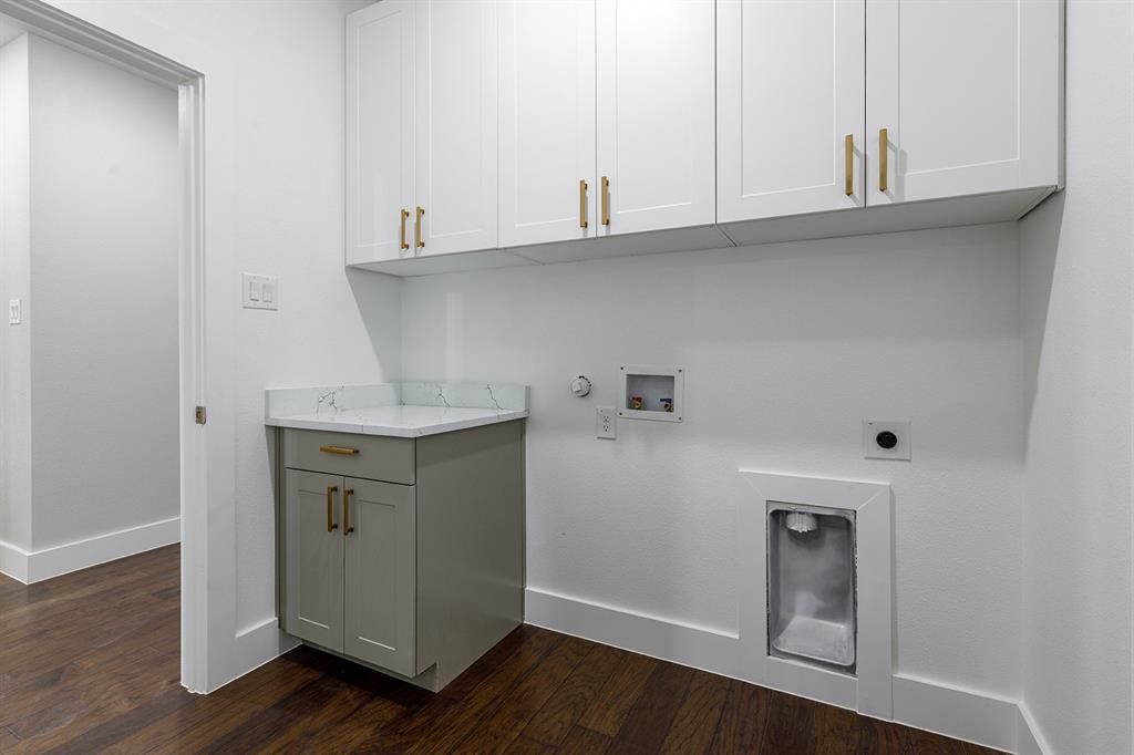 2809 Gooch Street Dallas, TX 75241 - Photo 10 of 19 a kitchen with cabinets and wooden floor