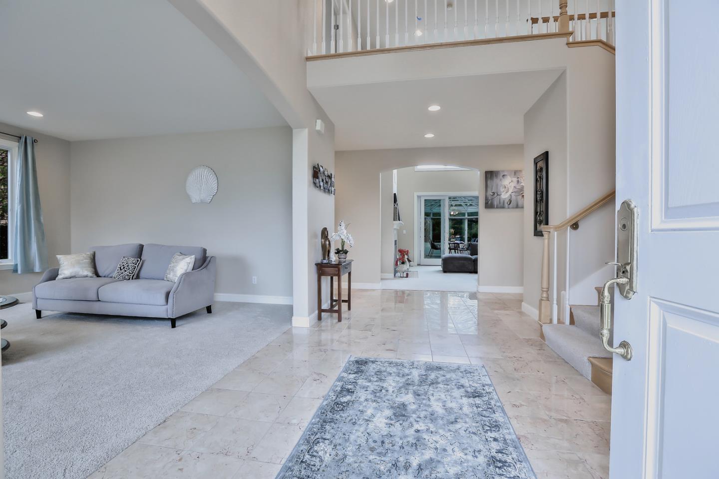 135 Cypress Point Road Half Moon Bay, CA 94019 - Photo 11 of 80 a living room with furniture and a rug