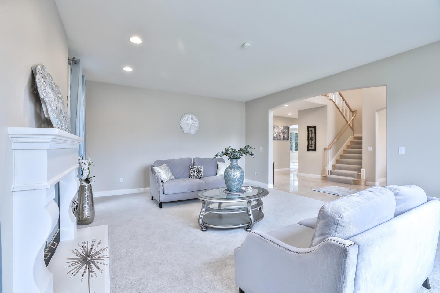 135 Cypress Point Road Half Moon Bay, CA 94019 - Photo 15 of 80 a living room with furniture and a wooden floor