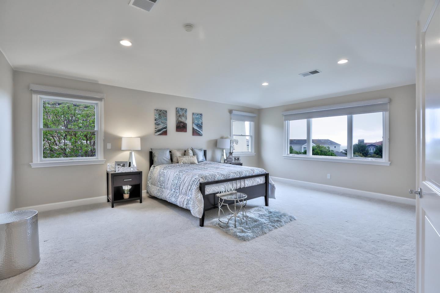 135 Cypress Point Road Half Moon Bay, CA 94019 - Photo 46 of 80 a bedroom with a bed and a window