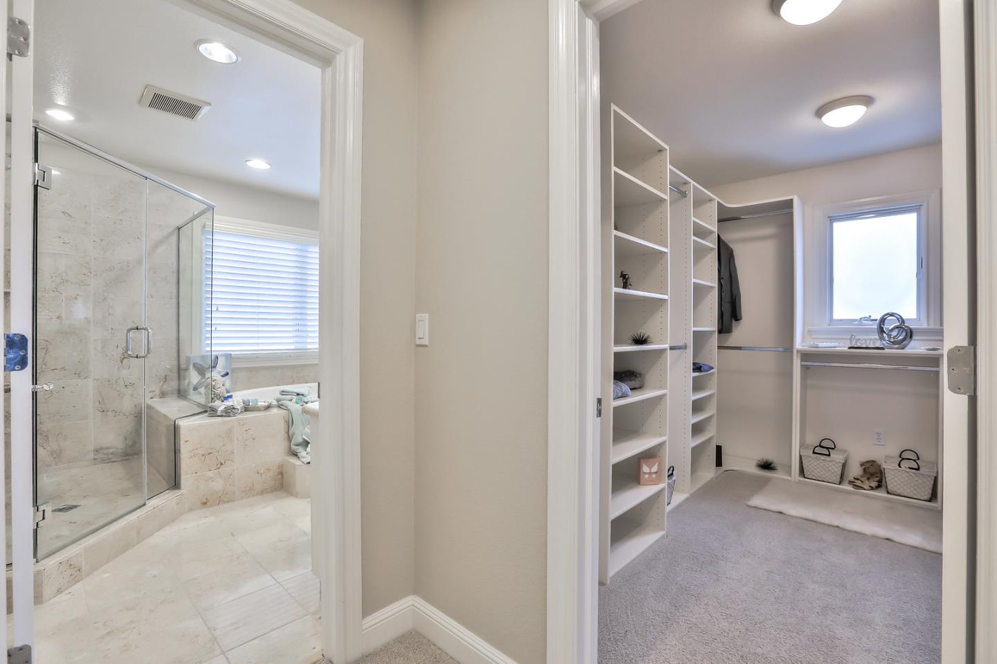 135 Cypress Point Road Half Moon Bay, CA 94019 - Photo 49 of 80 a bathroom with a double vanity sink and shower
