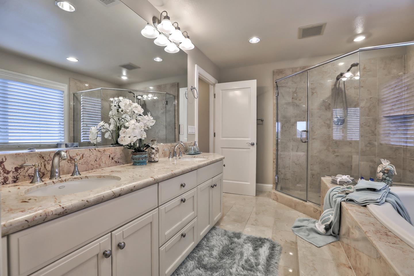 135 Cypress Point Road Half Moon Bay, CA 94019 - Photo 52 of 80 a bathroom with a double vanity sink mirror and shower