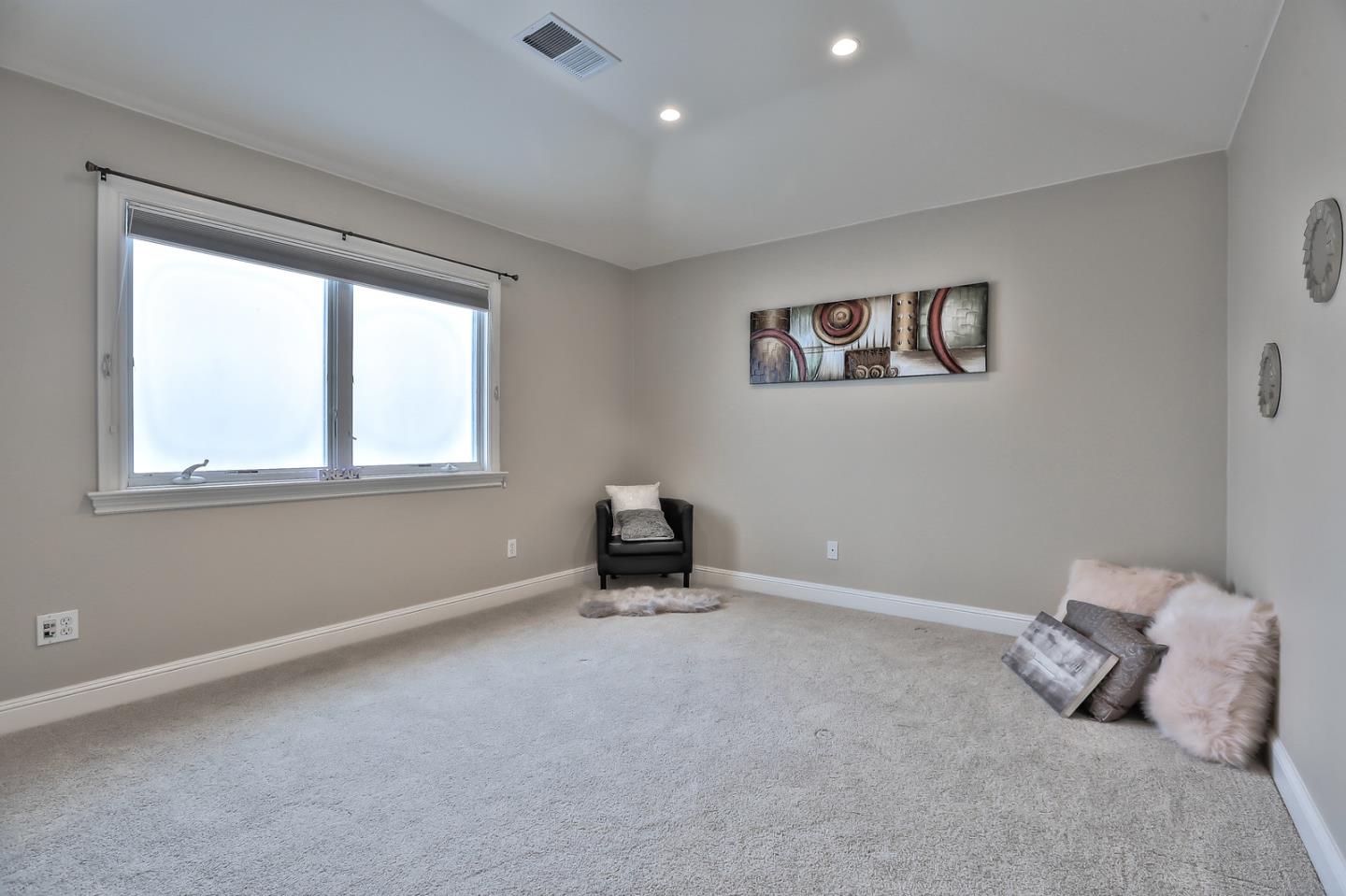 135 Cypress Point Road Half Moon Bay, CA 94019 - Photo 57 of 80 a room with a bed and a window