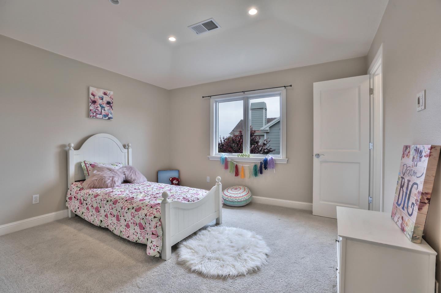 135 Cypress Point Road Half Moon Bay, CA 94019 - Photo 59 of 80 a bedroom with a bed and window