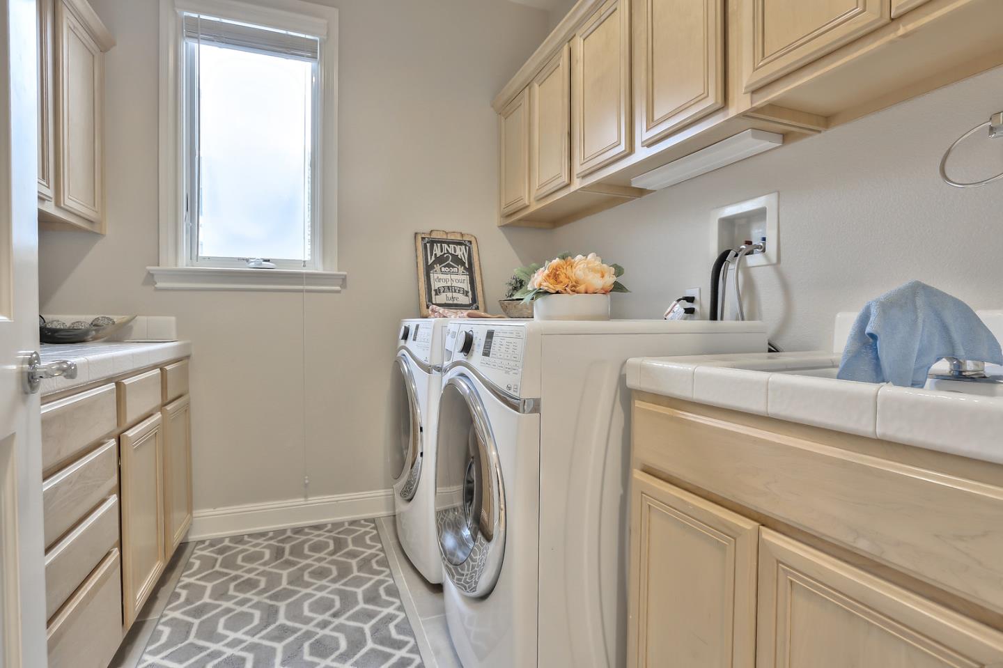 135 Cypress Point Road Half Moon Bay, CA 94019 - Photo 65 of 80 a utility room with dryer and washer