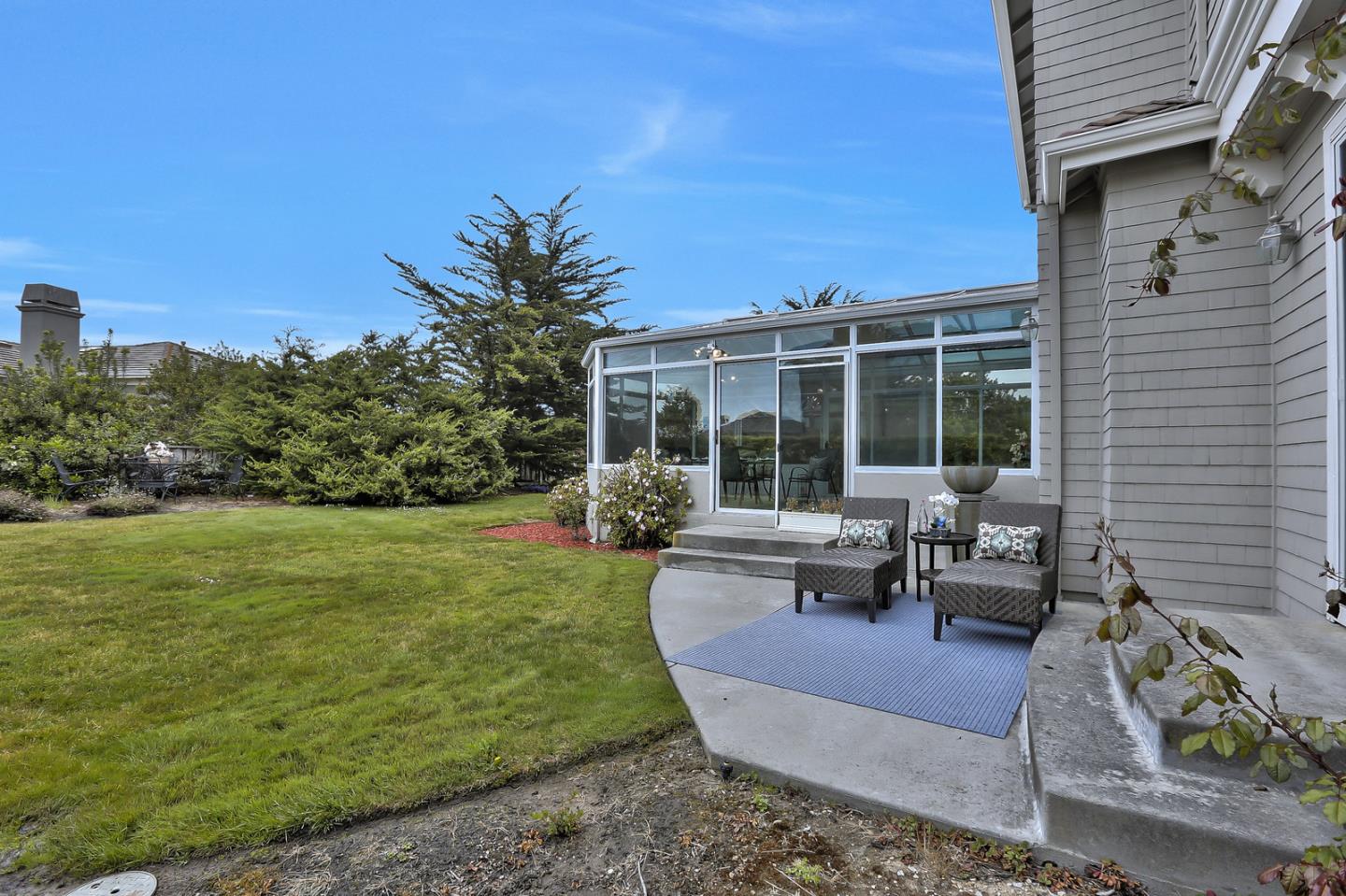 135 Cypress Point Road Half Moon Bay, CA 94019 - Photo 69 of 80 a view of a house with backyard porch and sitting area