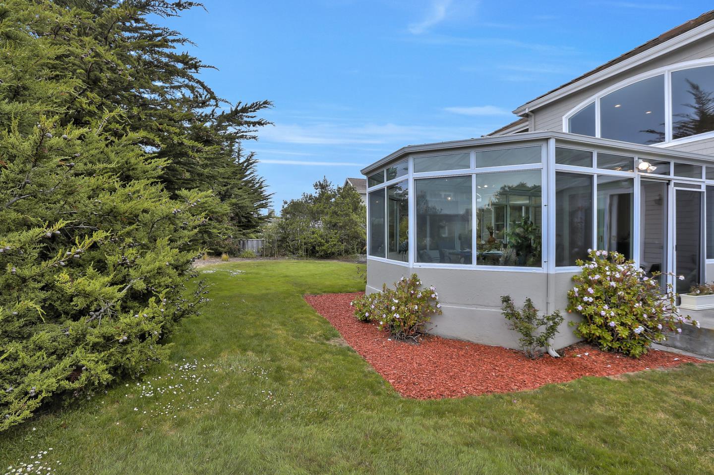 135 Cypress Point Road Half Moon Bay, CA 94019 - Photo 72 of 80 a view of a house with a yard