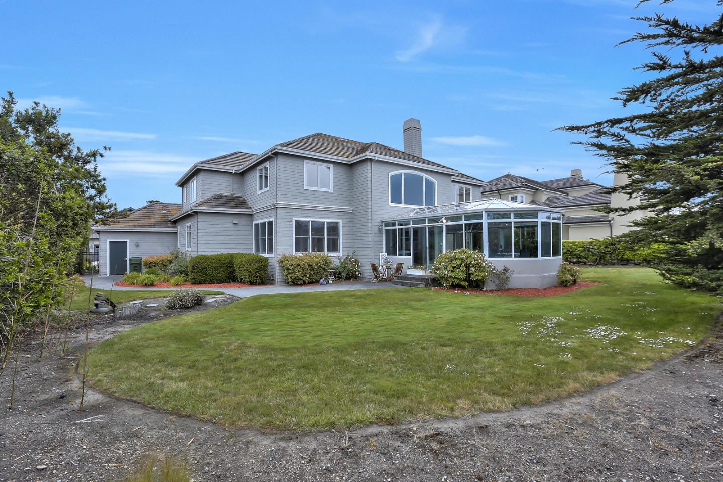 135 Cypress Point Road Half Moon Bay, CA 94019 - Photo 74 of 80 a front view of a house with a yard