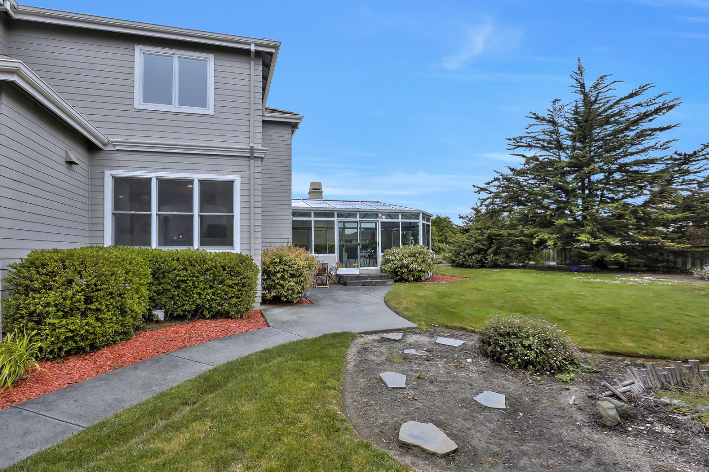 135 Cypress Point Road Half Moon Bay, CA 94019 - Photo 77 of 80 a front view of a house with garden