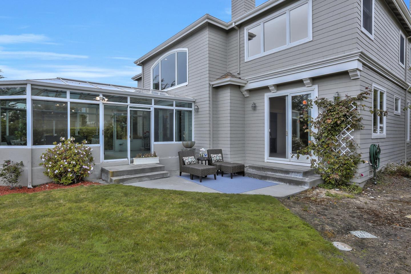 135 Cypress Point Road Half Moon Bay, CA 94019 - Photo 80 of 80 a view of a house with backyard sitting area and garden