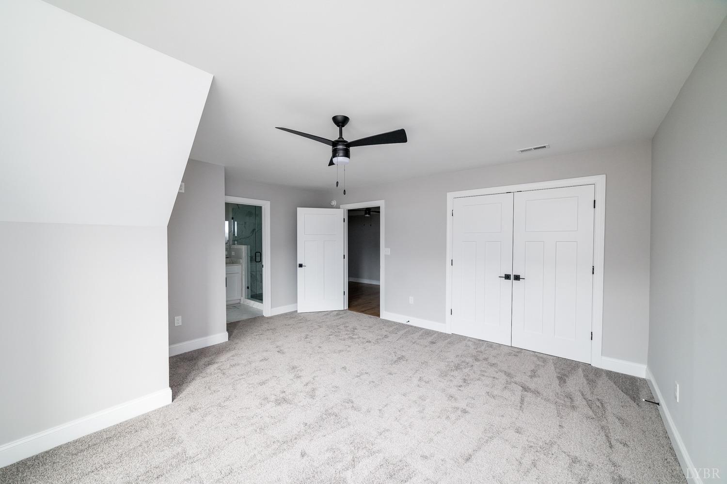 1073 South Westyn Loop Forest, VA 24551 - Photo 22 of 66 a view of a livingroom with a ceiling fan and wooden floor