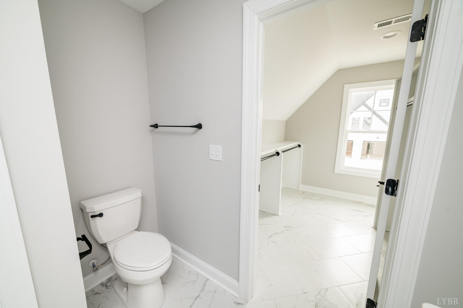 1073 South Westyn Loop Forest, VA 24551 - Photo 24 of 66 a bathroom with a toilet and a shower