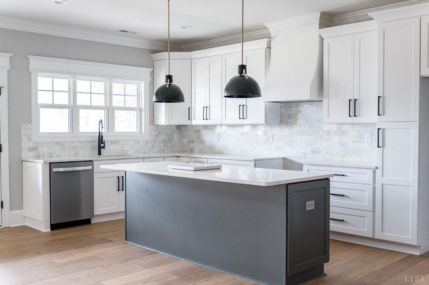 1073 South Westyn Loop Forest, VA 24551 - Photo 38 of 66 a kitchen with stainless steel appliances granite countertop a sink a stove and a refrigerator