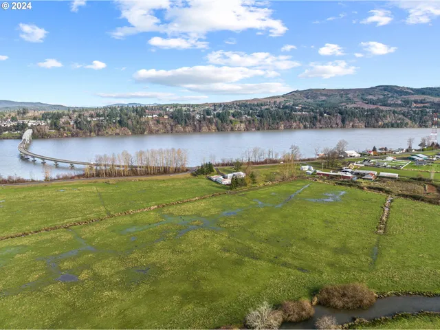 a view of a lake with houses in the back