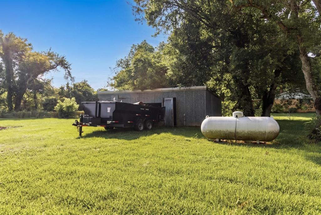 1925 Highway 527 Elm Grove, LA 71051 - Photo 4 of 15 a view of a backyard with table and chairs