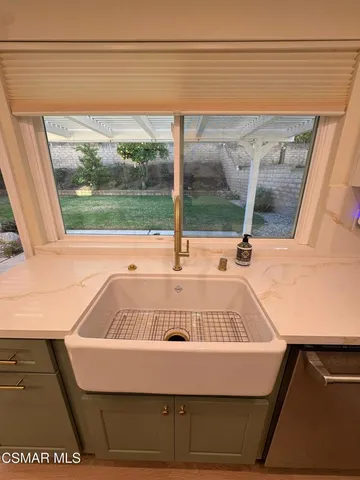 a view of a kitchen with furniture and staircase