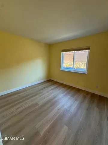 a view of room and wooden floor