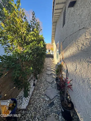 a view of a backyard of the house