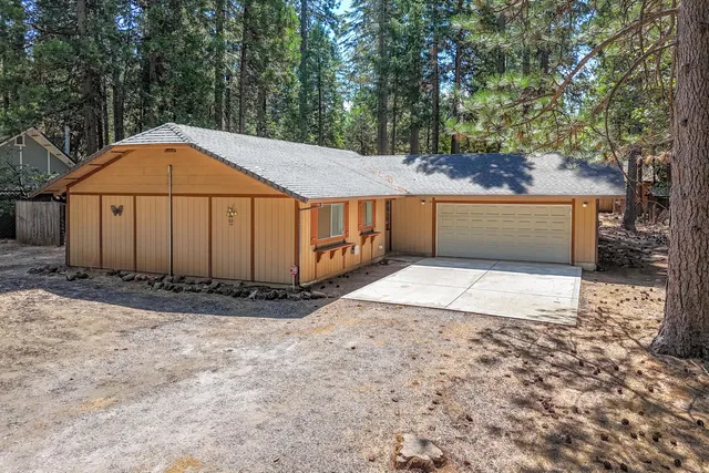 a view of a yard with trees
