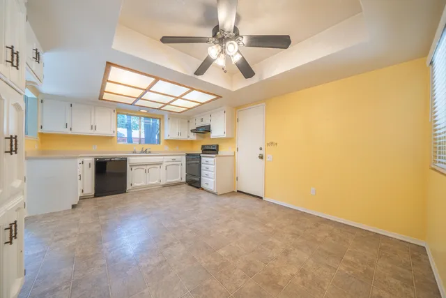 a view of a kitchen with a sink and a window