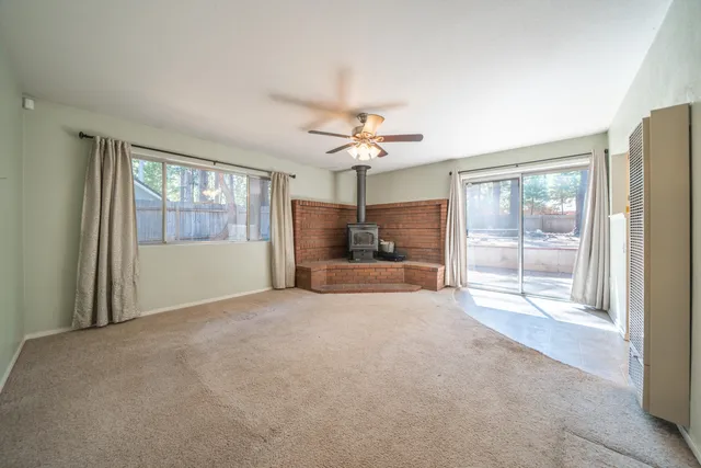 a view of livingroom with furniture window and ceiling fan