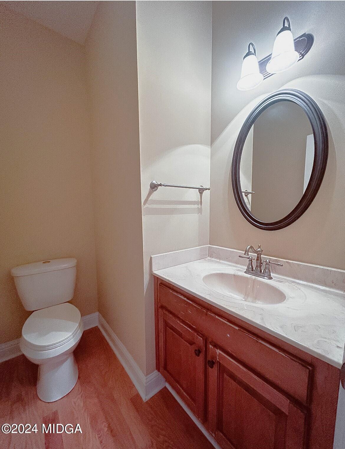 208 Pembroke Centerville, GA 31028 - Photo 16 of 30 a bathroom with a toilet and a sink