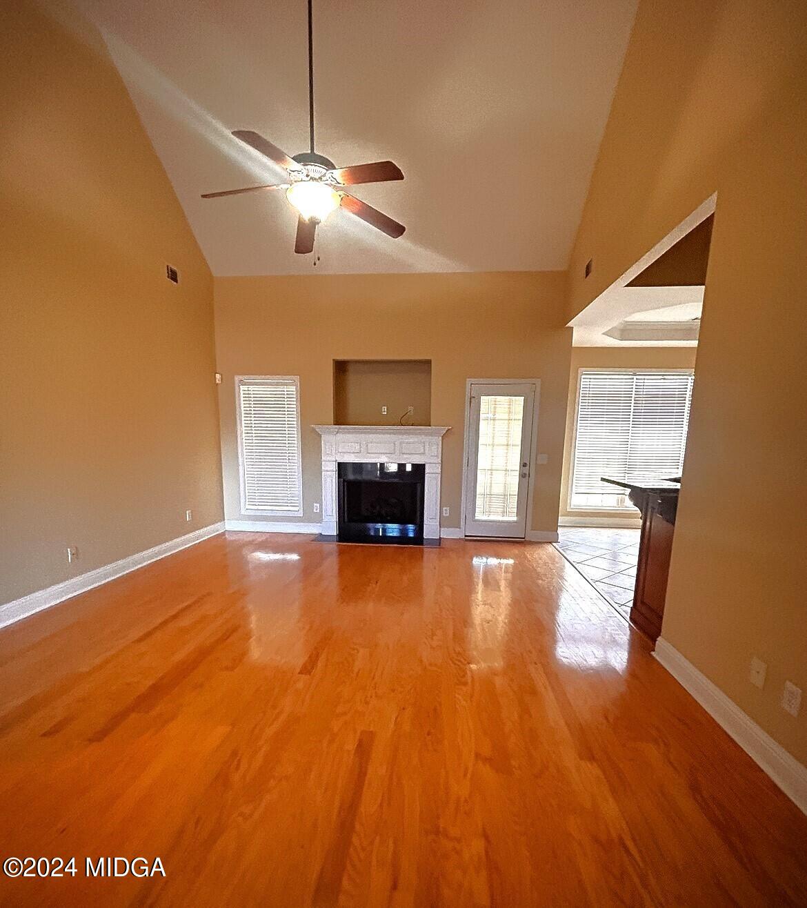 208 Pembroke Centerville, GA 31028 - Photo 20 of 30 a view of empty room with wooden floor and fireplace
