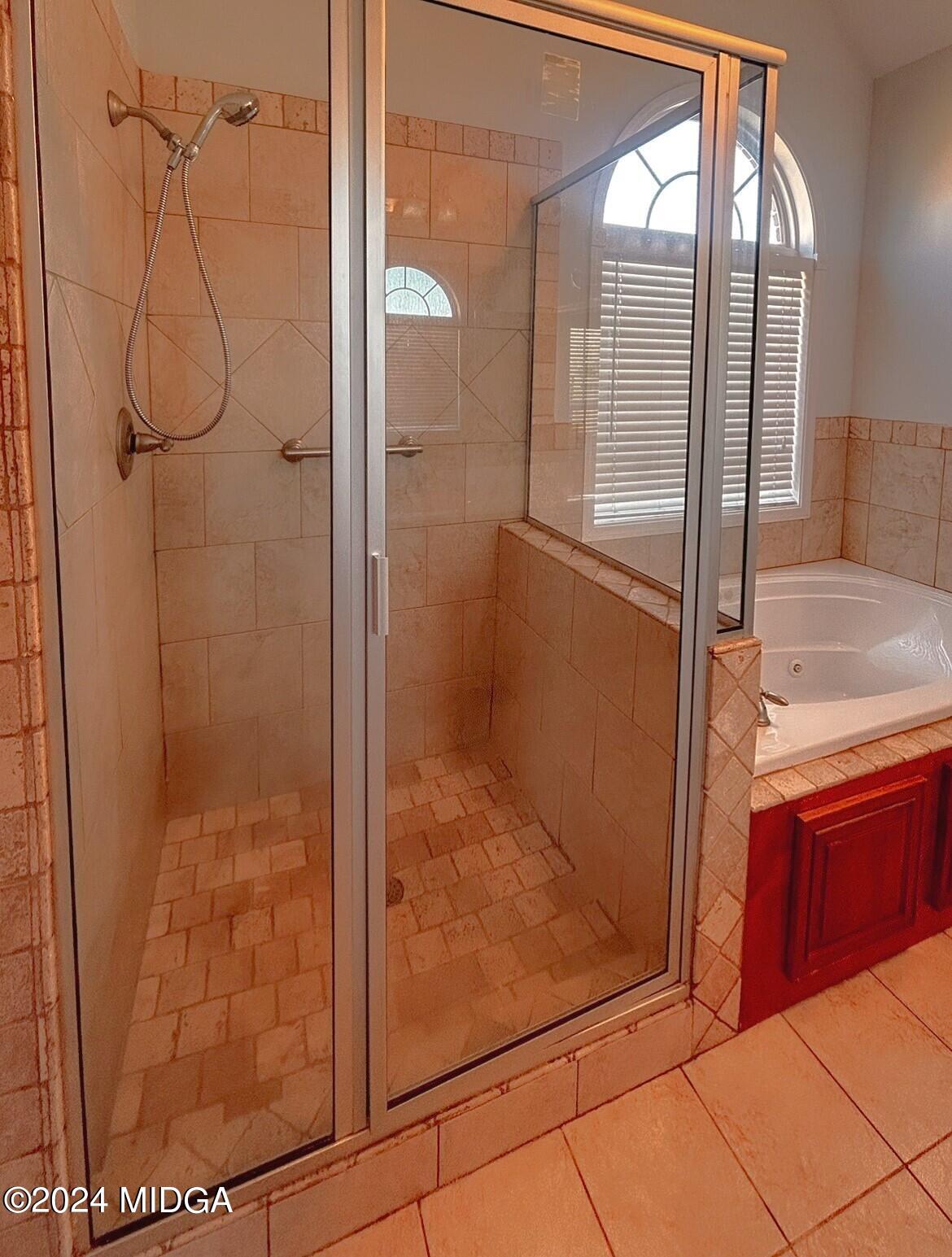 208 Pembroke Centerville, GA 31028 - Photo 21 of 30 a bathroom with a glass shower door