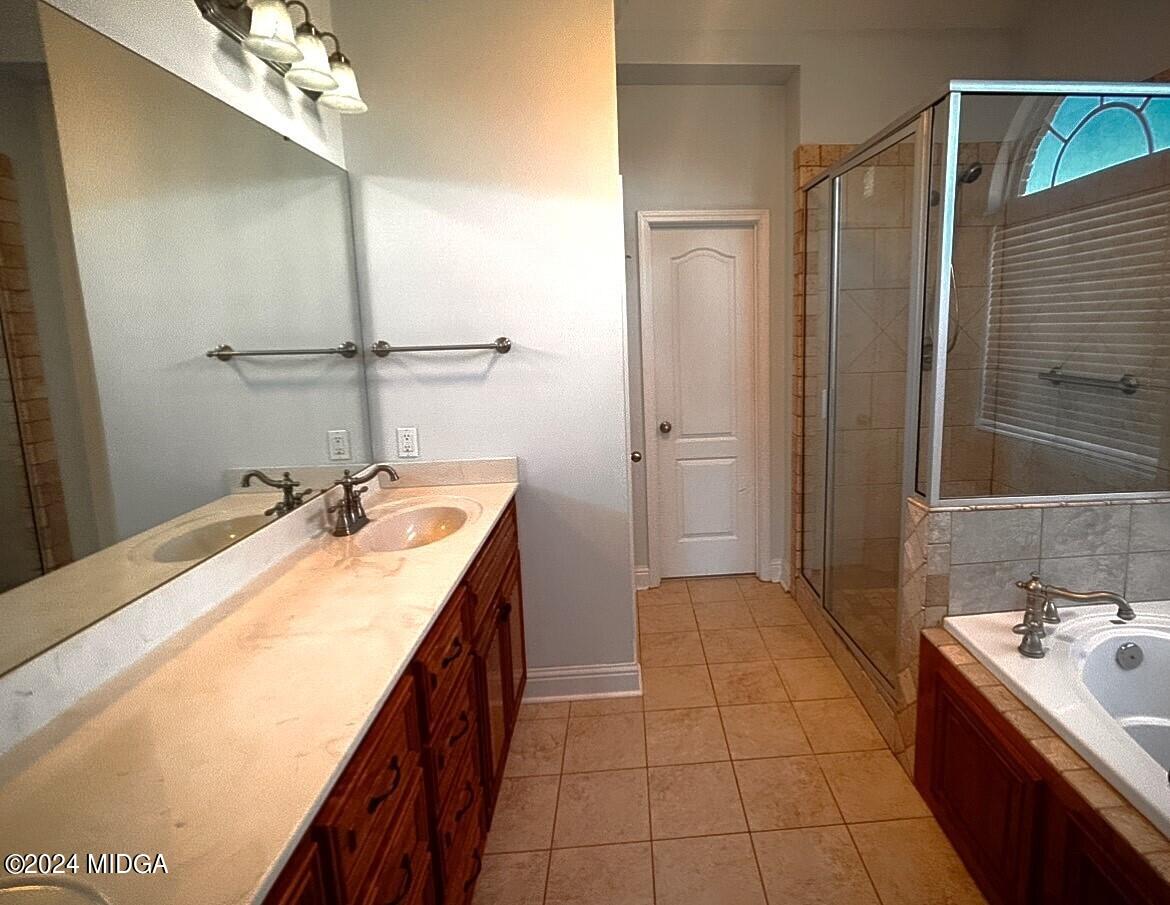 208 Pembroke Centerville, GA 31028 - Photo 23 of 30 a bathroom with a tub sink and mirror