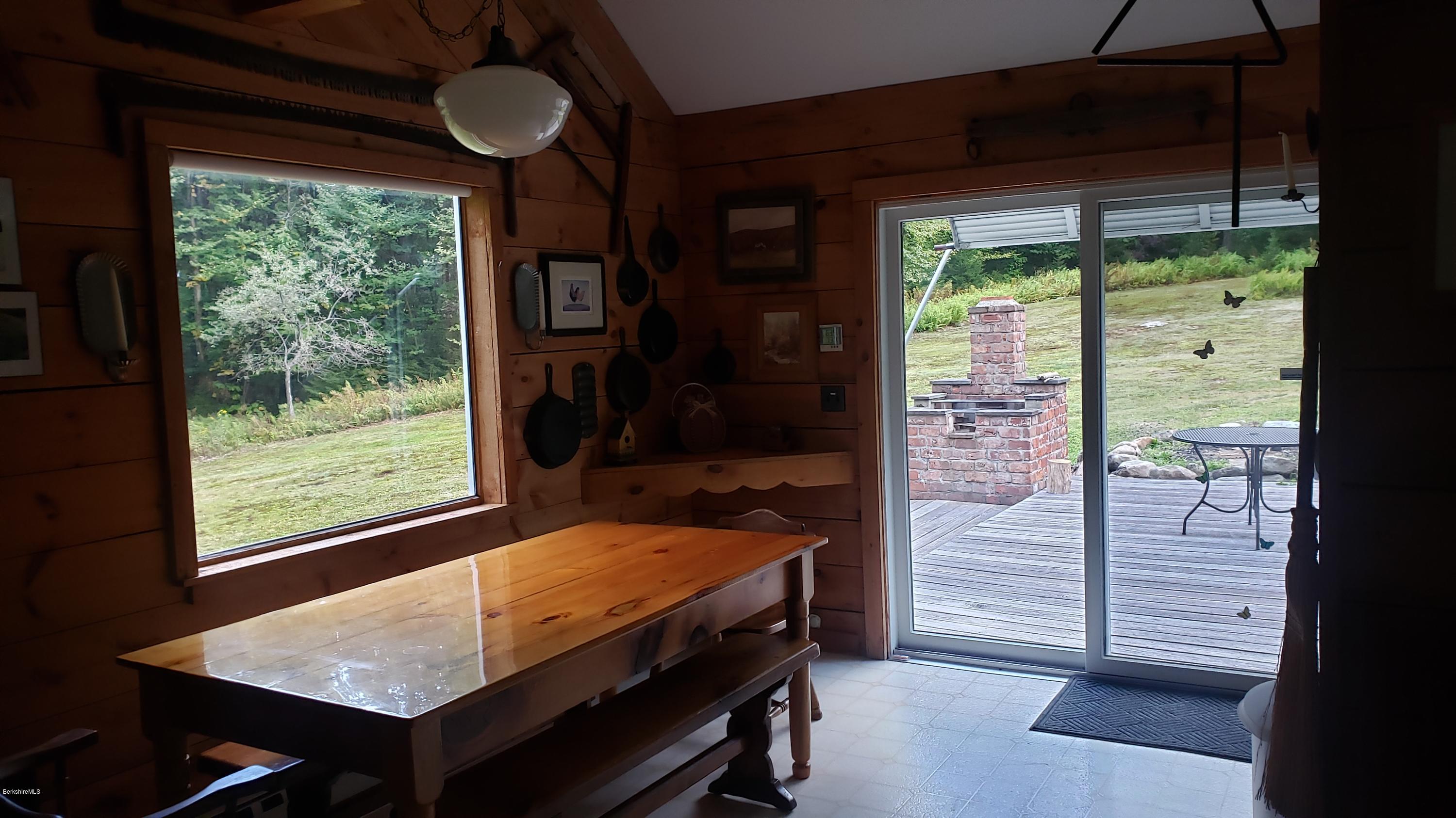 1507 County Road Stamford, VT 05352 - Photo 4 of 20 dining area out to back deck