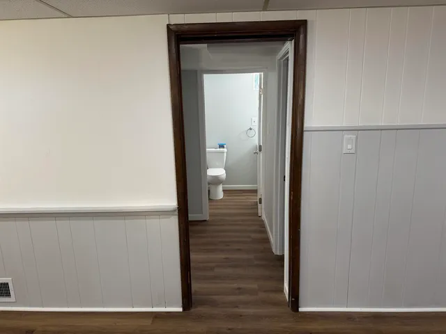 a view of a bathroom from a hallway