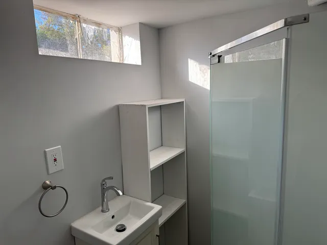 a bathroom with a sink and mirror