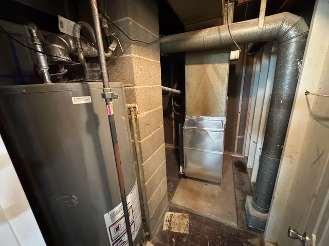 a view of walk in closet with racks on the wall