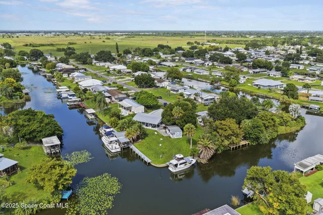 an aerial view of a house with a garden