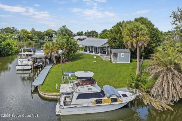 a view of living room and porch with furniture