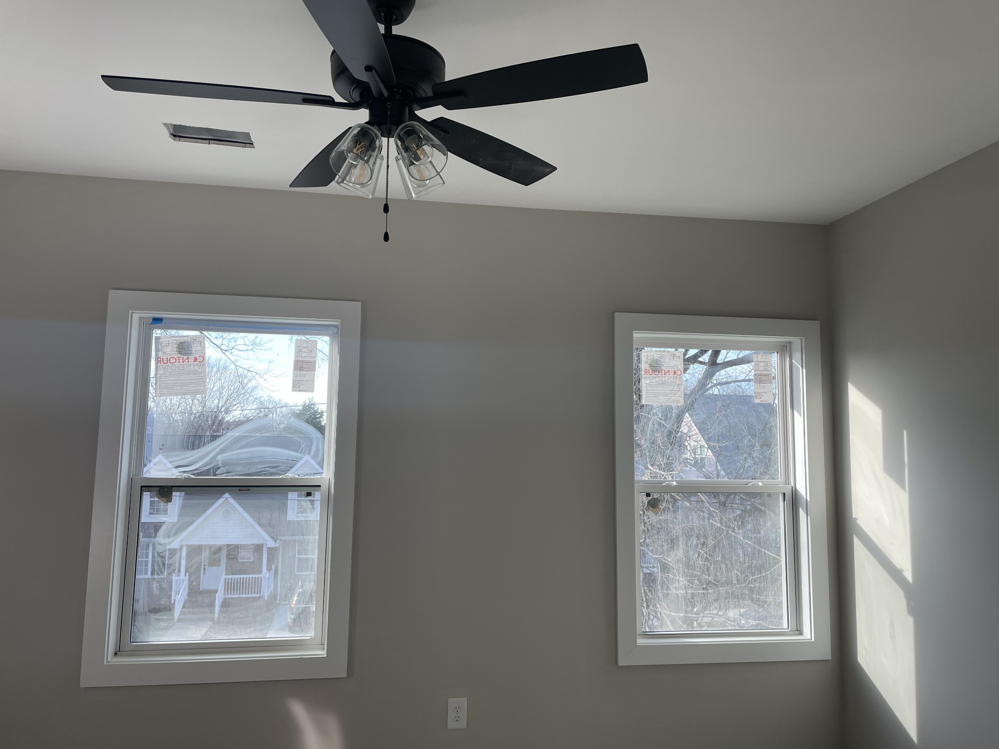 Undisclosed Address Nashville, TN 37210 - Photo 11 of 13 an empty room with windows and fan