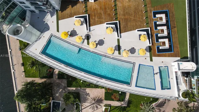 a view of a swimming pool with a lounge chairs
