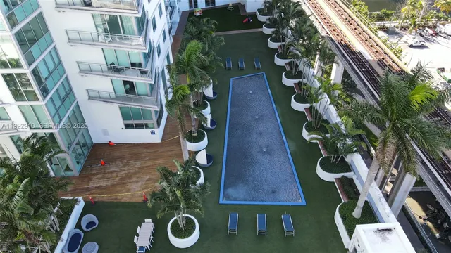 a view of a swimming pool with a lounge chairs