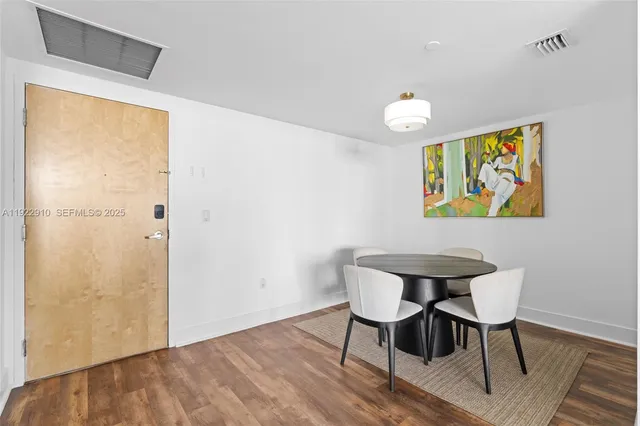 a view of kitchen with sink and cabinets