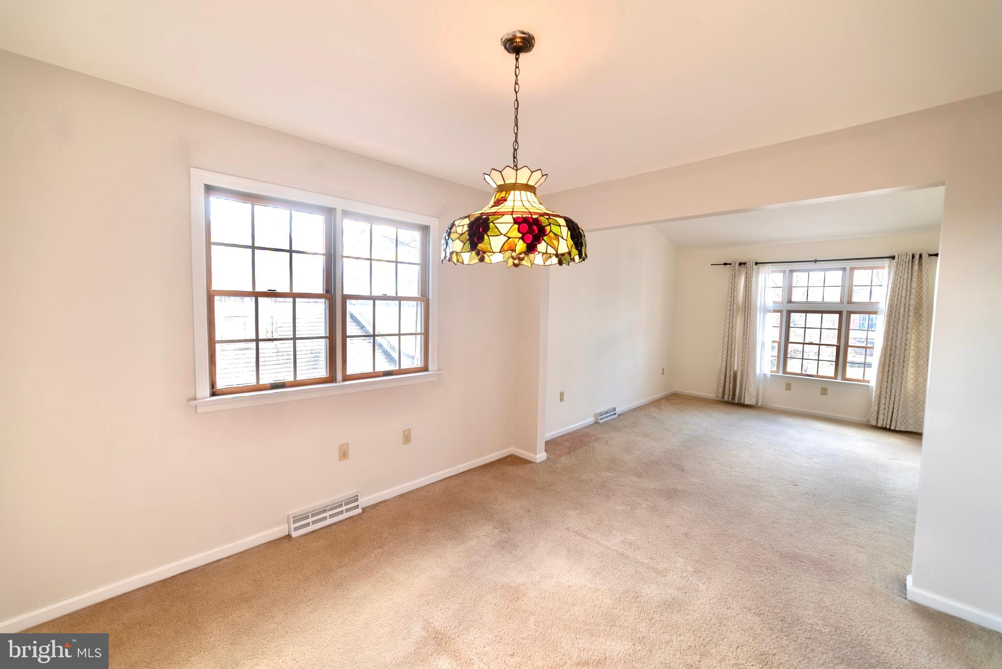 619 Stoney Run Road Pottsville, PA 17901 - Photo 15 of 41 an empty room with windows and chandelier