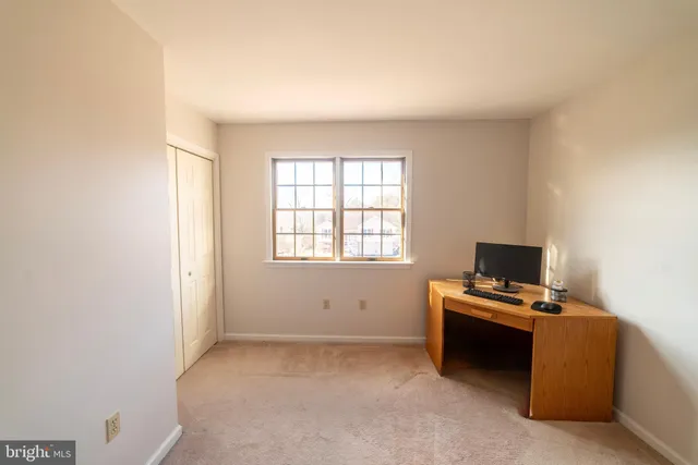 a workspace with furniture and window