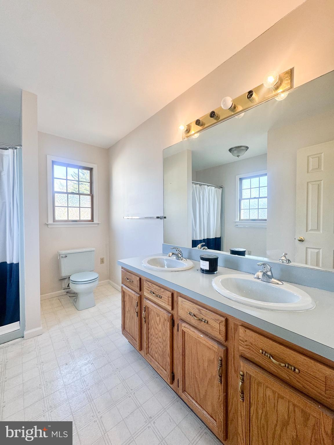 619 Stoney Run Road Pottsville, PA 17901 - Photo 31 of 41 a spacious bathroom with a granite countertop toilet sink and mirror
