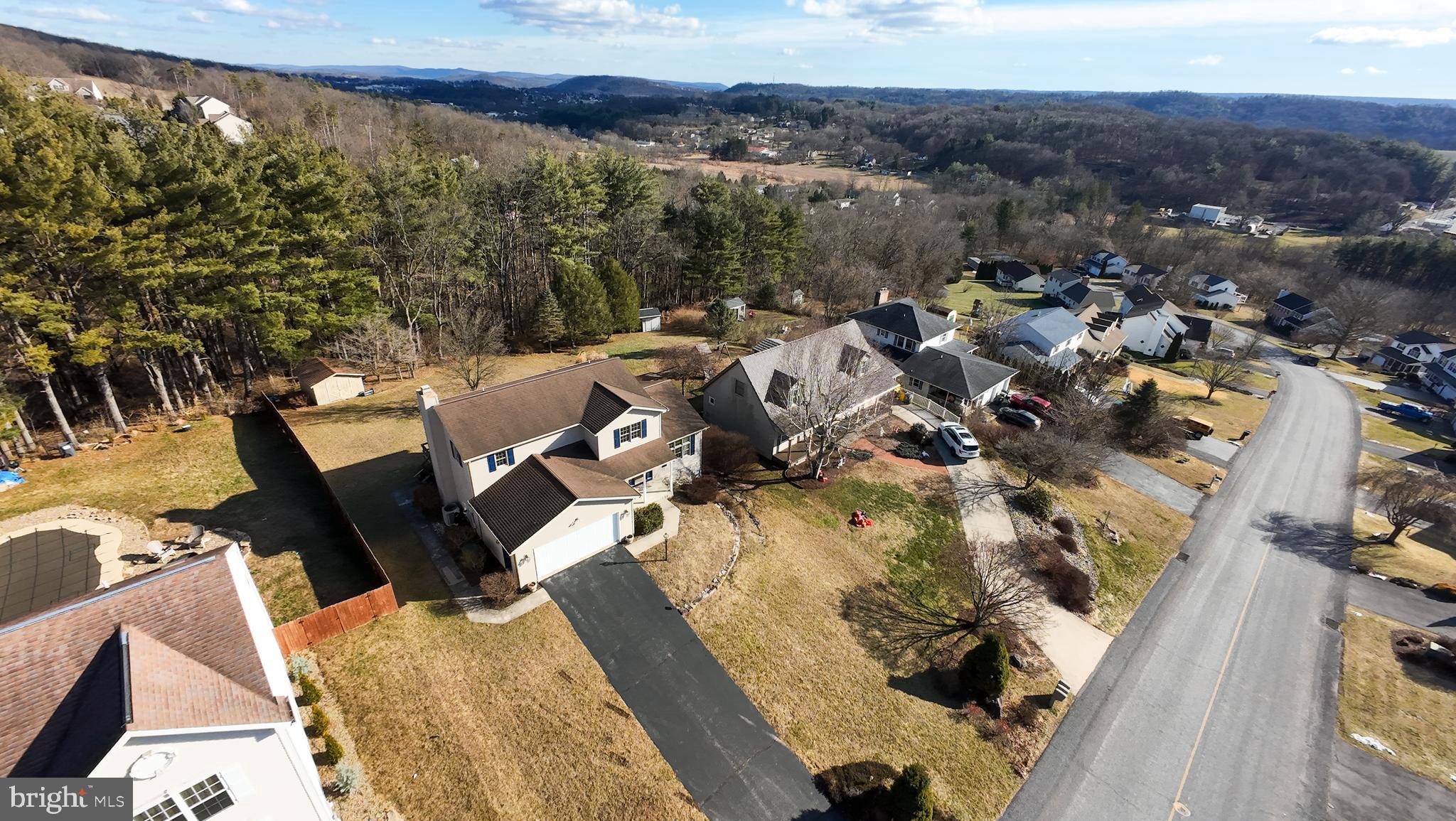619 Stoney Run Road Pottsville, PA 17901 - Photo 38 of 41 an aerial view of a house with a yard and lake view