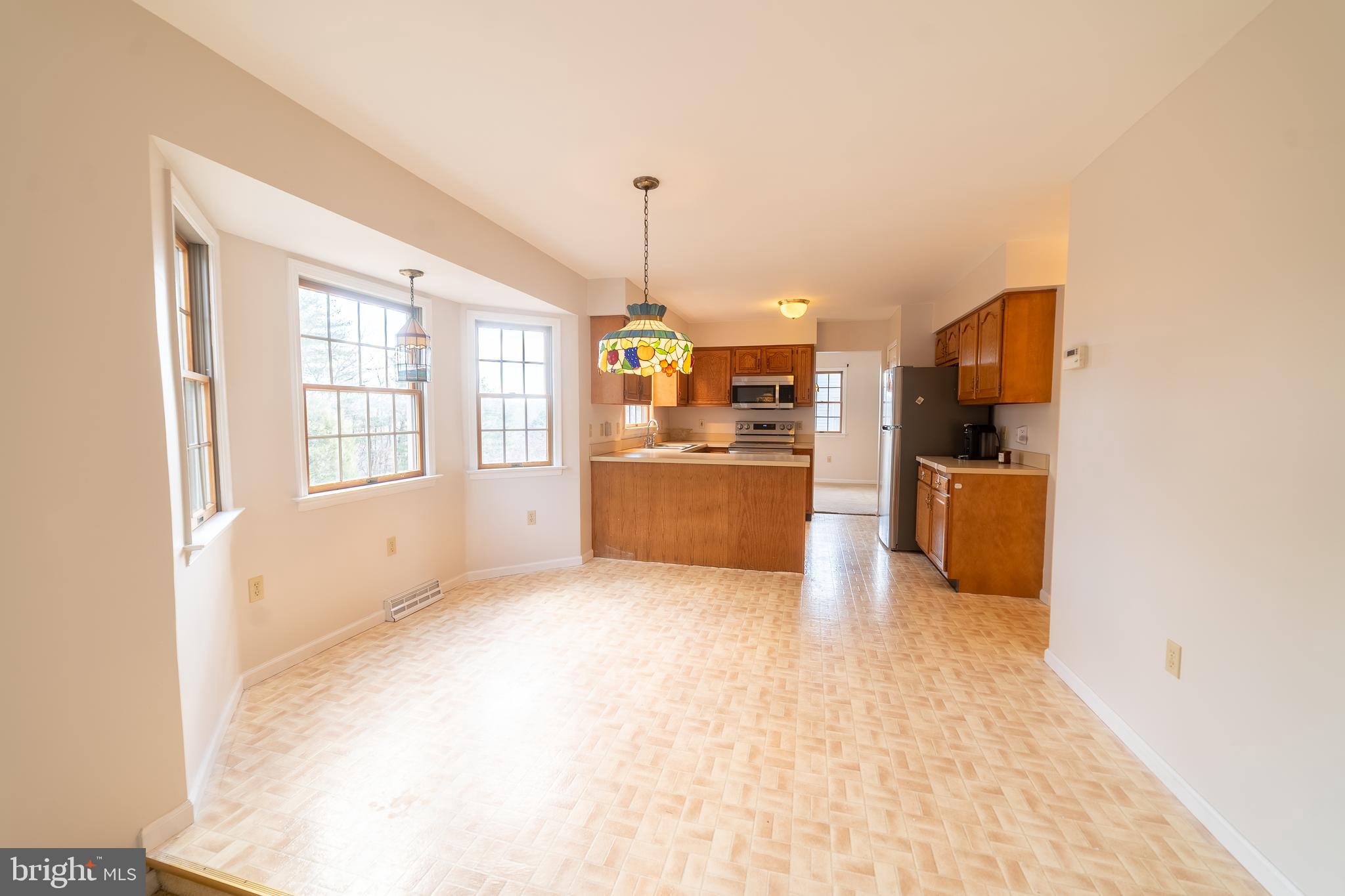 619 Stoney Run Road Pottsville, PA 17901 - Photo 9 of 41 a view of a kitchen with a refrigerator a stove top oven and a dishwasher