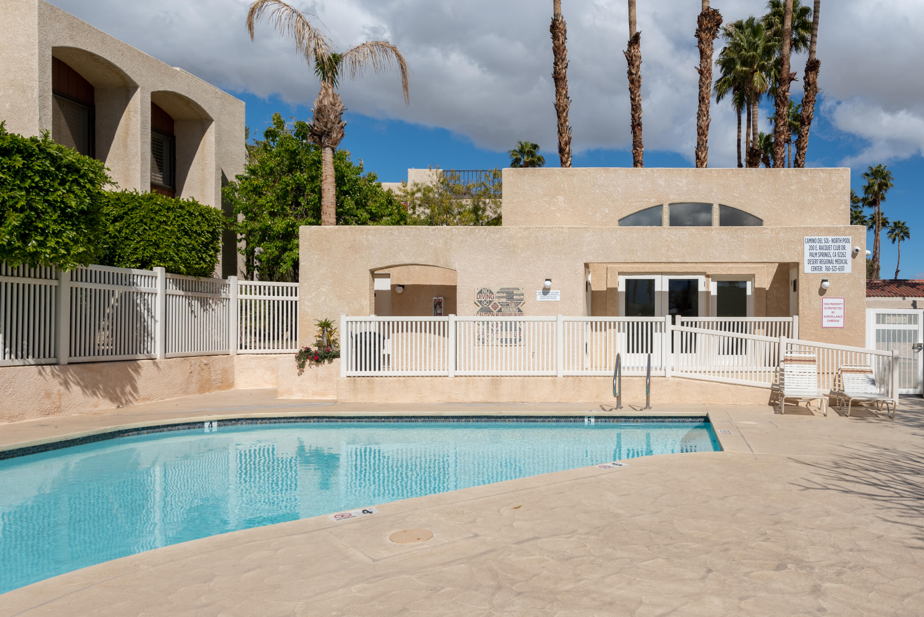 200 East Racquet Club Road, Unit 65 Palm Springs, CA 92262 - Photo 25 of 27 a view of a house with a backyard